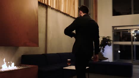 stylish man in a modern bar lounge