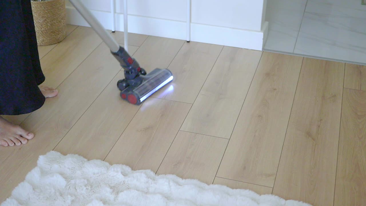 Vacuuming a hardwood floor