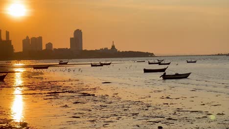 boats drift on serene waters at sunset