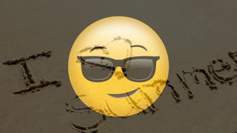 sonriente amarillo con texto en la playa