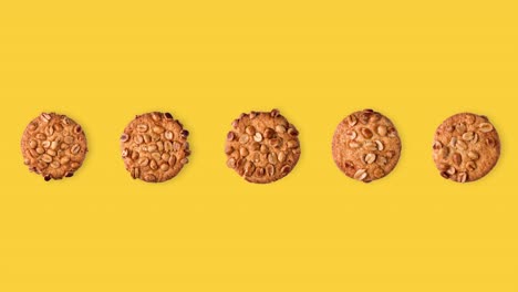 seamless looping funny animation of peanut cookies on a yellow background