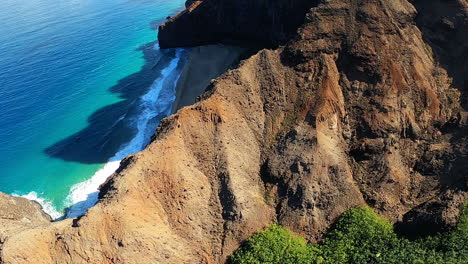 aerial view of a hawaiian coastline beach and cliffs