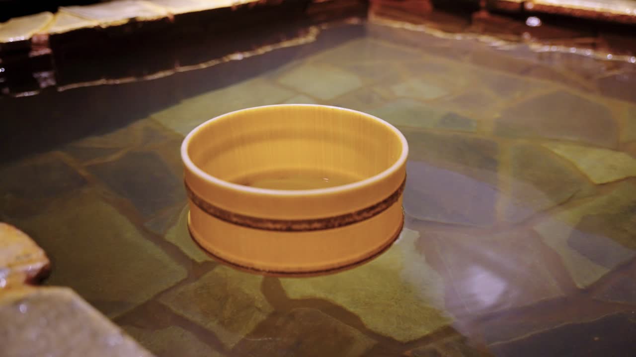 Bamboo Style Bucket Floating in Japanese Onsen Hot Spring