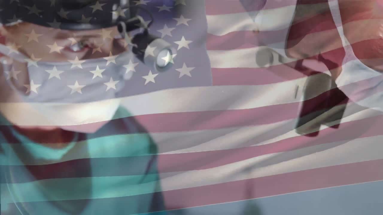 animación de la bandera de los estados unidos ondeando sobre los cirujanos en el quirófano