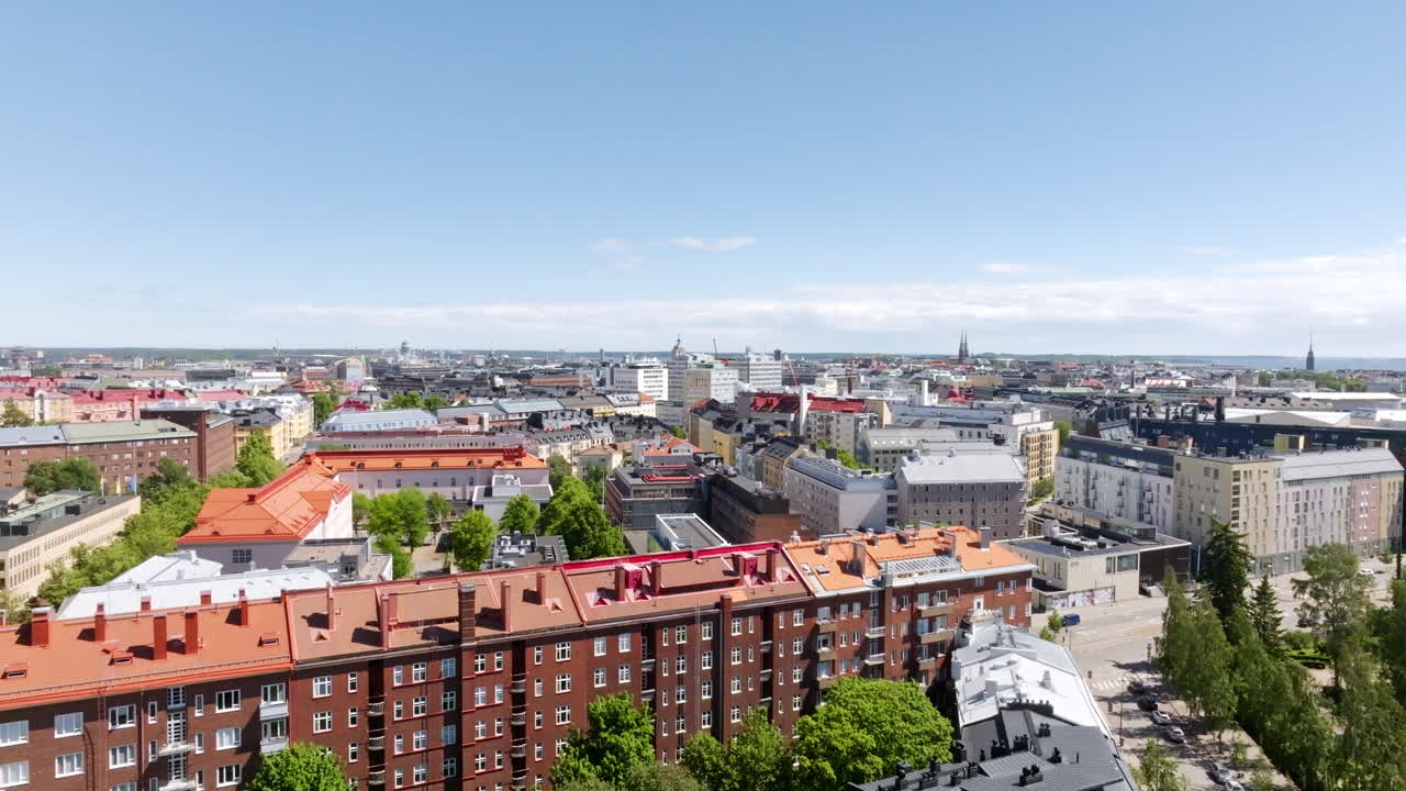 Aerial ascending shot revealing the cityscape of Kamppi, summer day in Helsinki