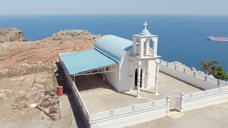 small church at the sea cliffs in crete island near chania, greece