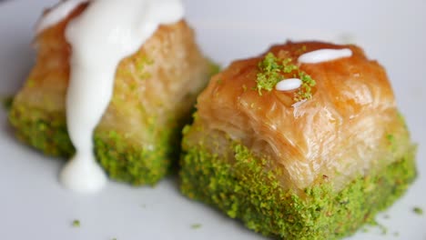 close up of delicious baklava with pistachio and cream