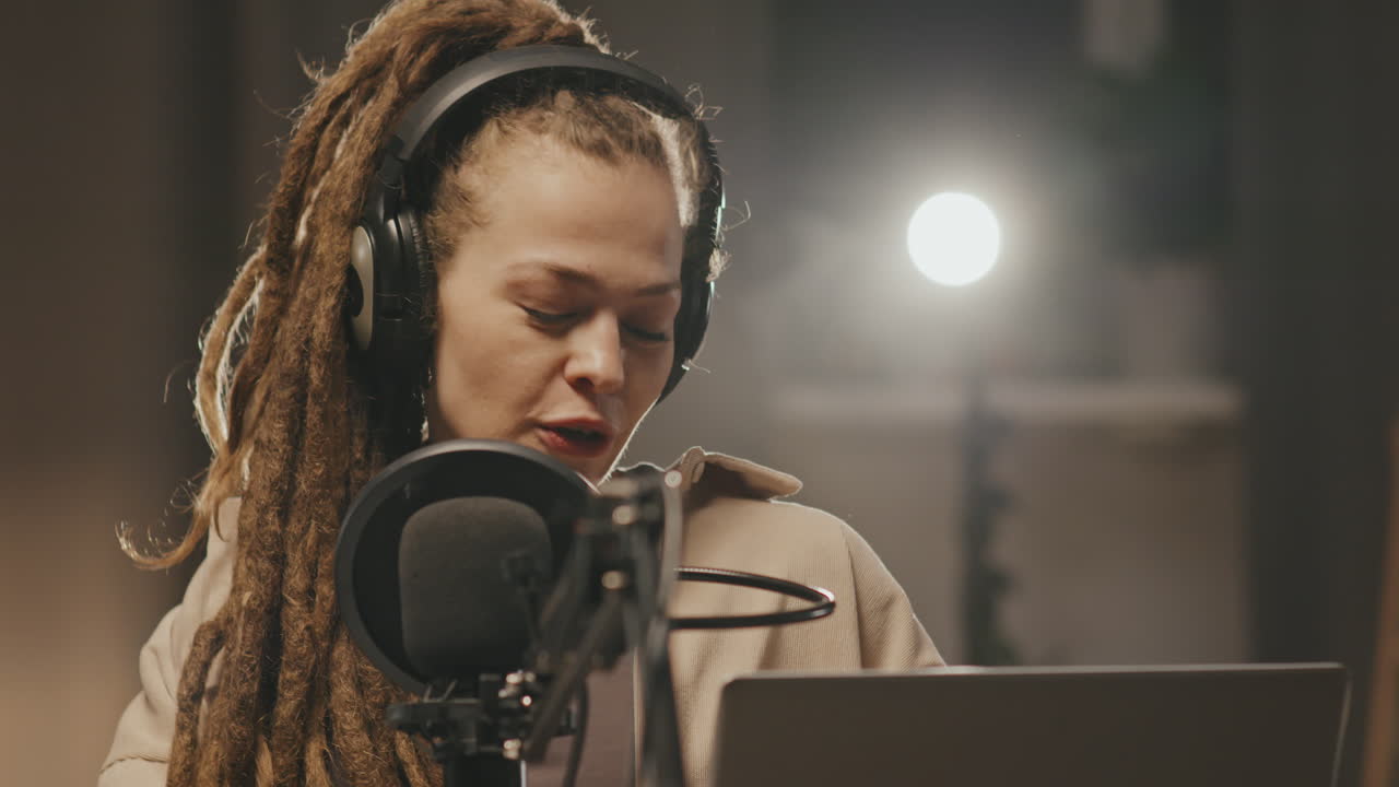 Beautiful Woman with Dreadlocks Hosting Radio Show