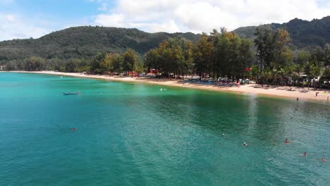 aerial view of tourists scuba diving and snorkeling at kamala beach, phuket, thailand