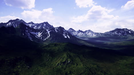 majestic mountain range under a clear sky showcasing lush greenery