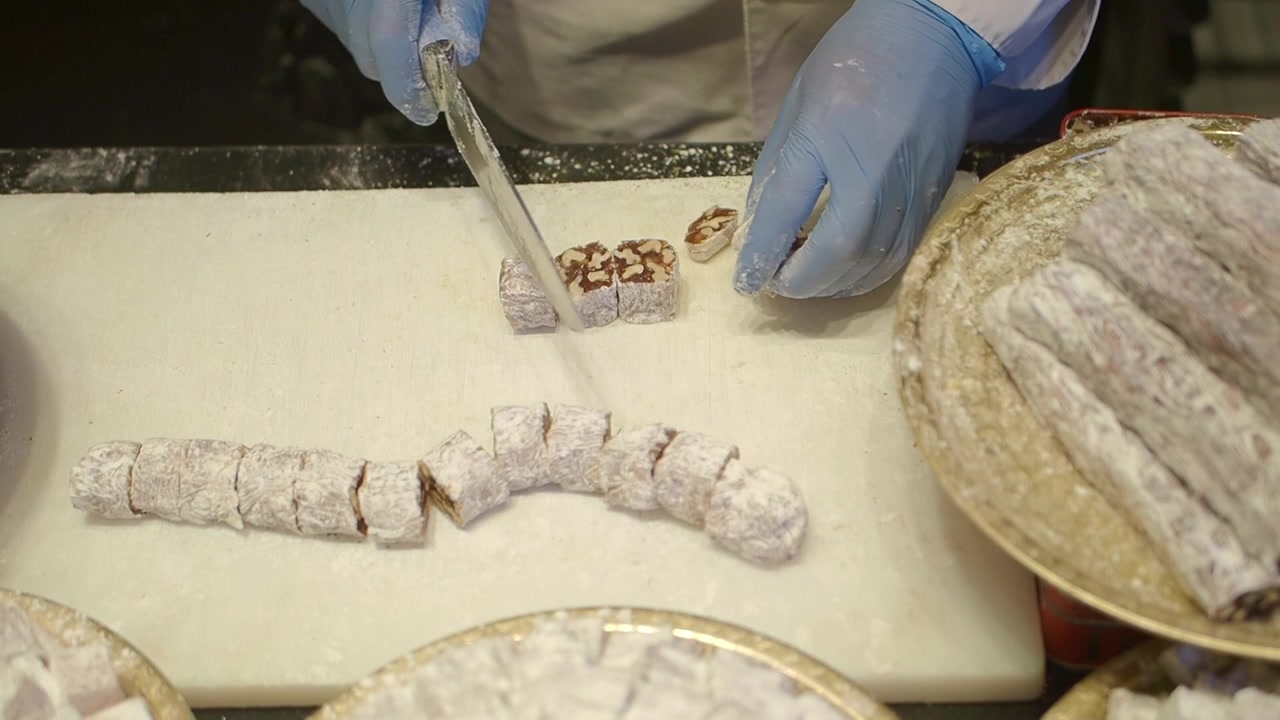 Confectioner Cutting Turkish Delight on a Cutting Board