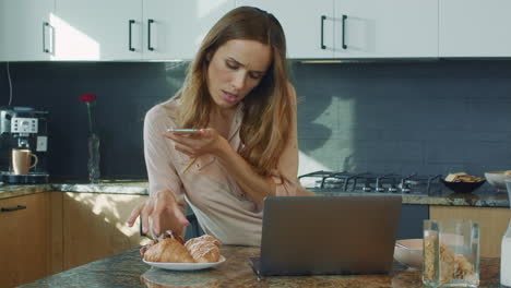 concentrated woman making photo at mobile phone. serious woman taking food photo