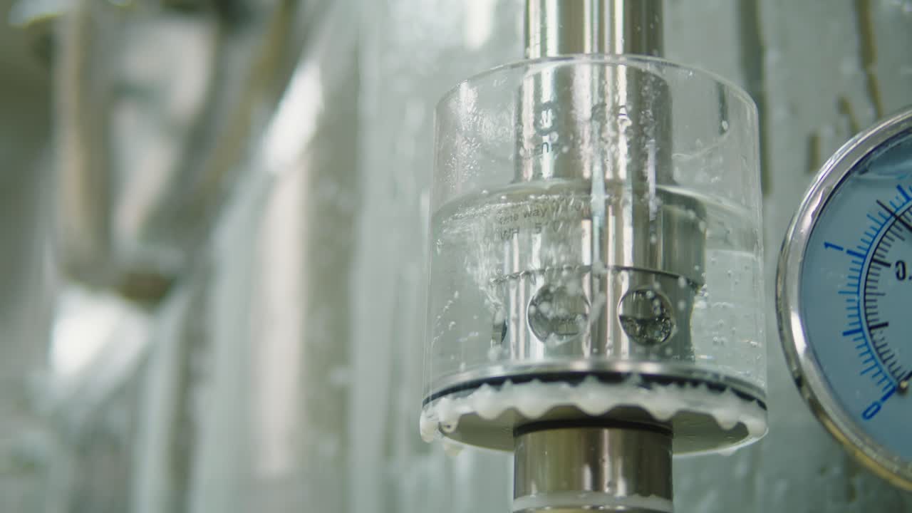 Craft beer production, general cleaning on factory, brewery manufacture. Washing metal vats bottles. Brewing, cooking alcohol