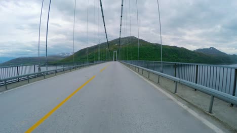 vehicle point-of-view driving over the bridge.