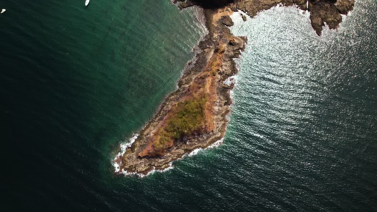 Aerial drone view gimbal up of Guanacaste peninsular isthmus and it's Costa Rican coastal landscape