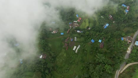 Beautiful-estates-located-at-the-foot-of-the-Himalayas-in-Nepal,-explored-by-a-drone