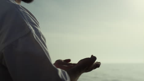 closeup man hands training karate techniques on sunset. sport lifestyle.