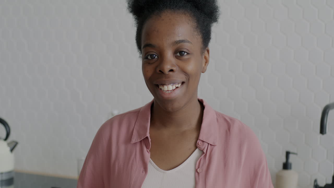 Woman talking in kitchen