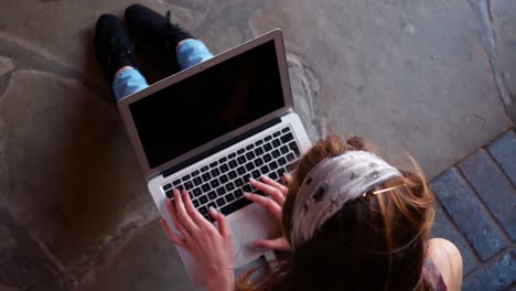 schoolgirl using laptop