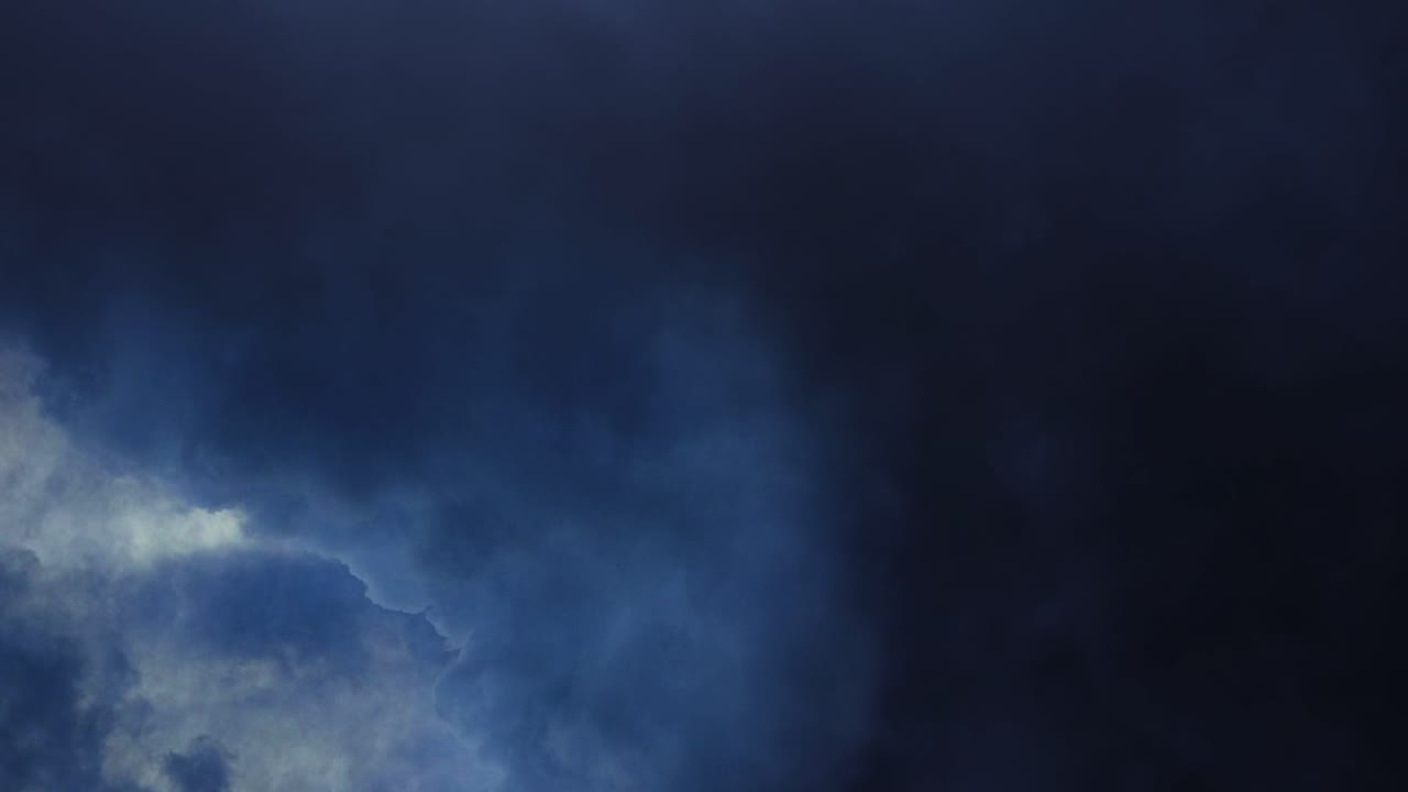 thunderstorm, dark clouds in the sky with lightning in them