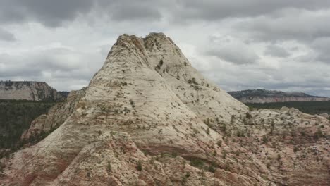 wide panning drone around rocky mountain within zion national park