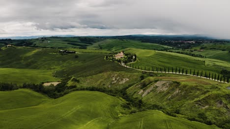 drone shot of farmland in asciano, italy