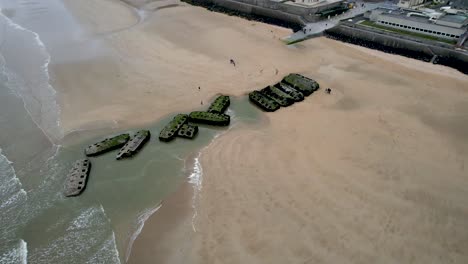 aerial view of town of arromanches les bain in normandy france with ww2 bunker ruins