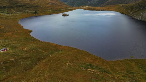 Aerial-over-the-rugged-hills-and-lakes-near-Vanylven-Municipality,-Norway