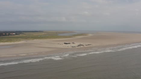 Drone---Aerial-panorama-circling-shot-of-the-sandy-beach-with-tourists-and-people-in-St