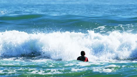 Surfers-surfing-in-sea