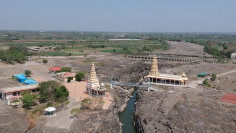 aerial drone footage of a river with potholes - at nighoj near pune and is famous for the naturally created potholes on the riverbed of the kukadi river