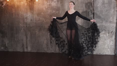 ballet dancer in a black tulle dress