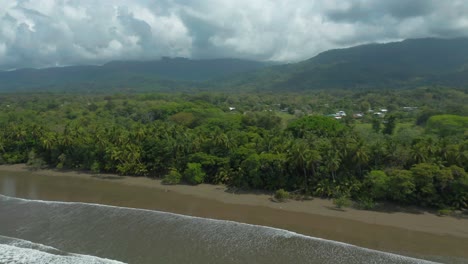 Uvita-tropical-beach-with-palm-trees-in-Costa-Rica,-aerial