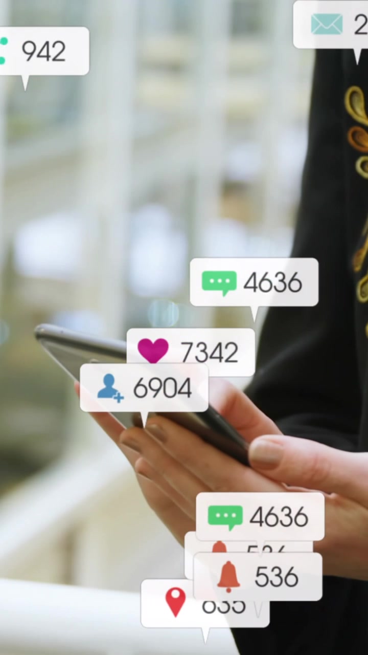 Animation of message icons with changing numbers over midsection of caucasian woman using cellphone