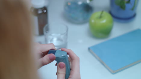 asthma inhaler on table. medical equipment on treatment of asthma attack