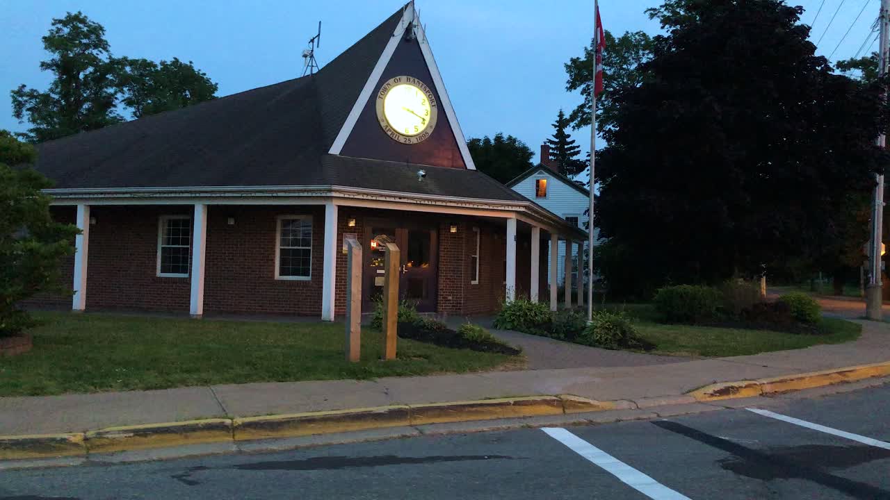 Driving by the municipal building and post office in Hantsport Nova Scotia Canada at dusk