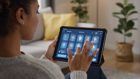 woman using tablet for smart home control