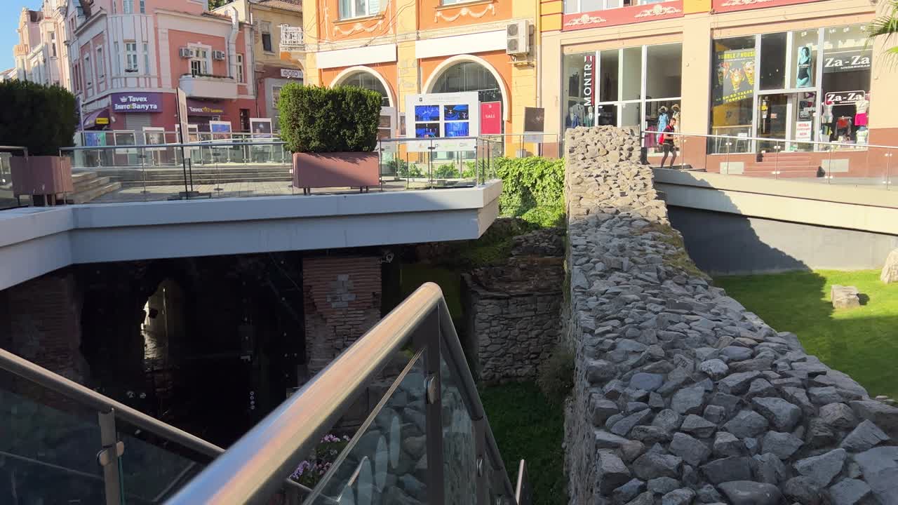 The Roman Stadium Square on the main pedestrian street with revealed parts of the fortress wall built back in the 2nd century AD. Dzhumaya Square. Jumayata.