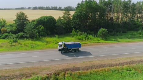 truck driving on a country road