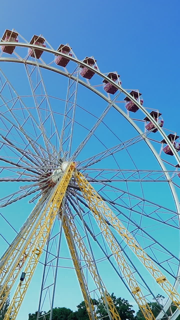 Ferris wheel is located in the fun park zone Vertical video