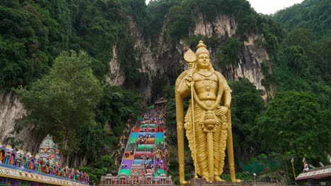 murugan statue outside the batu caves dolly in