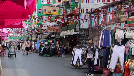 shoppers navigate through a vibrant outdoor market.