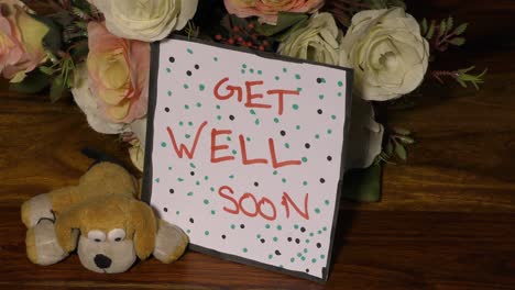 get well soon card with dots and flowers with soft toy dog