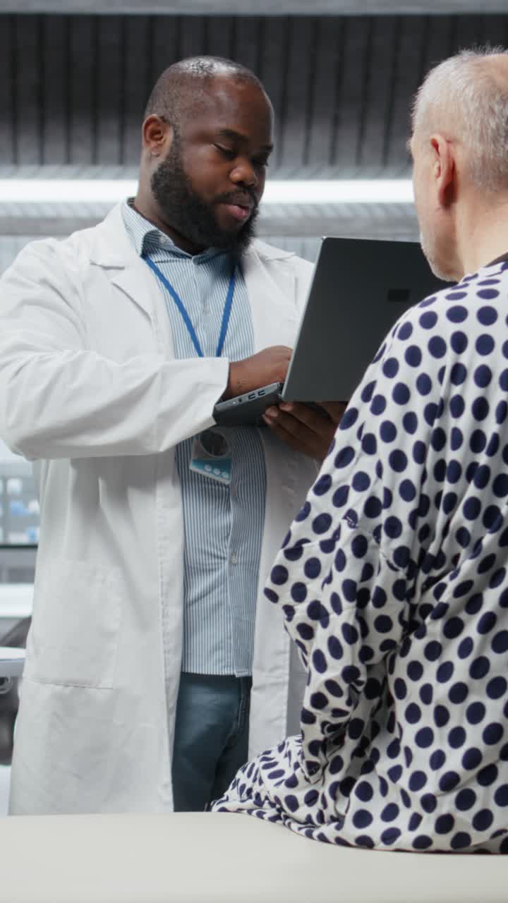 Vertical Video African american medic notes clinical evaluation of patient in laboratory study