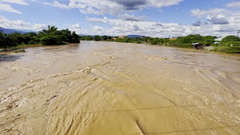 raging flash floods flowing in chiang mai province, northern thailand