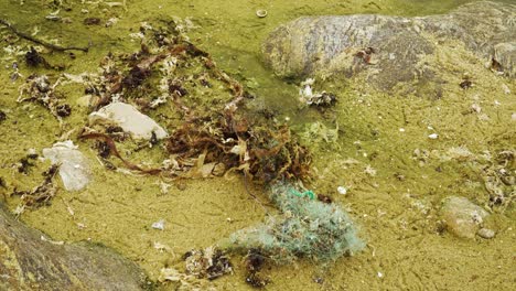 Fishnet-near-dry-water-stream-in-the-beach-of-Matosinhos,-Porto,-Portugal