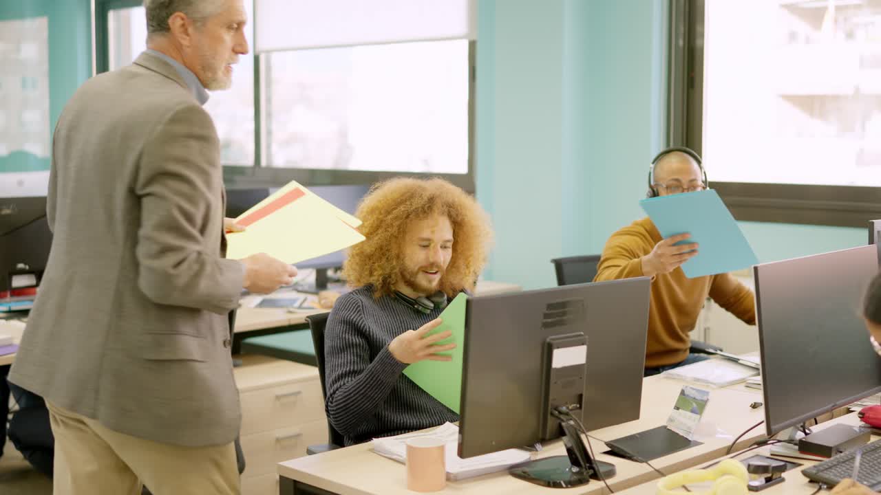 Manager distributes files to a team in coworking space
