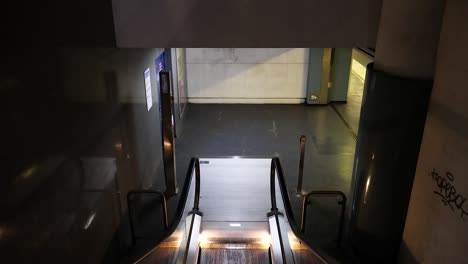 an empty escalator in napoli, italy station