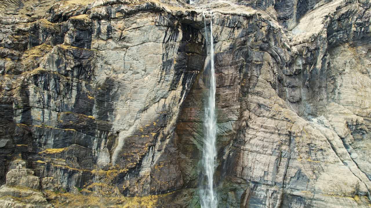 Zoom out of majestic Gavarnie Falls in French Pyrenees amphitheater