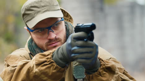 a man plays airsoft with a pistol in his hand 5